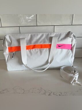 Nike Radiate Club Duffle Bag with Neon Orange and Pink Accents